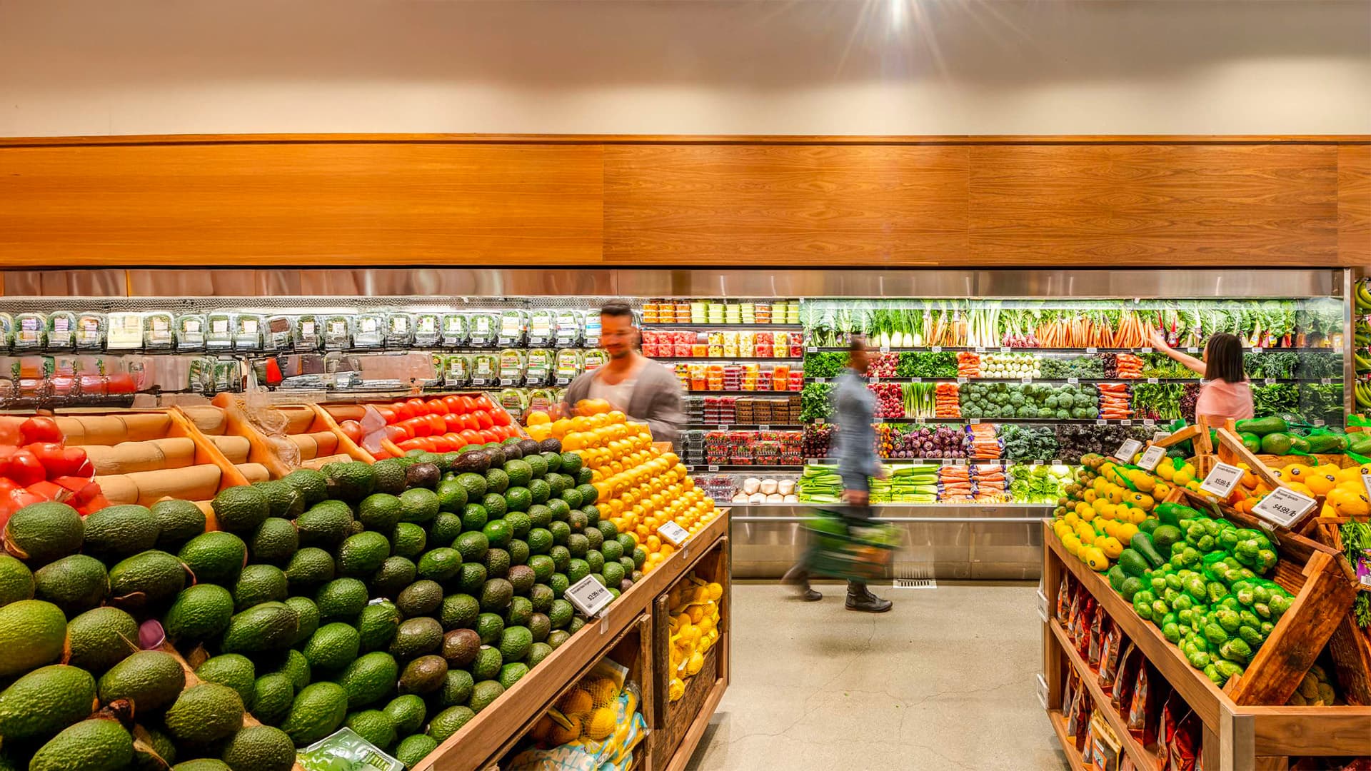 Grocery store produce section with fresh fruits and vegetables